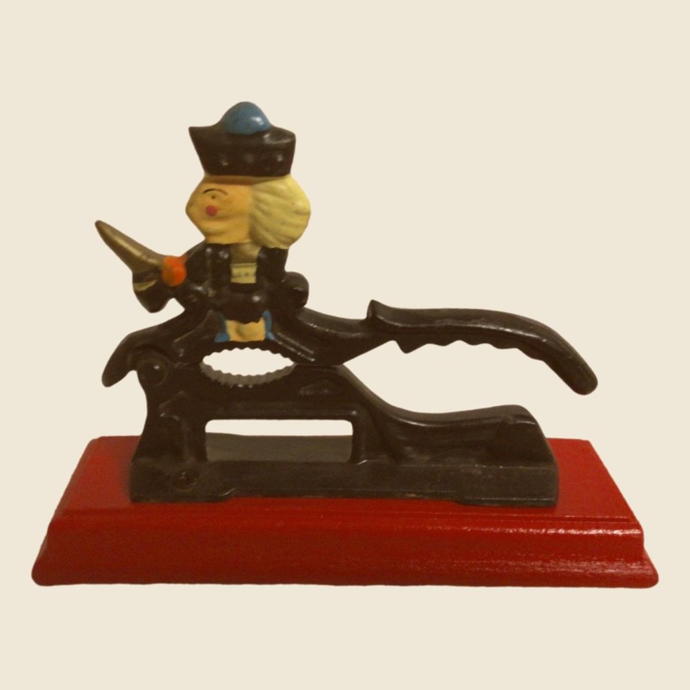 Swordsman Cast Iron Nutcracker with Large Red Wooden Pedestal